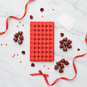 Complete set flat lay with mold, spatula, and chocolates